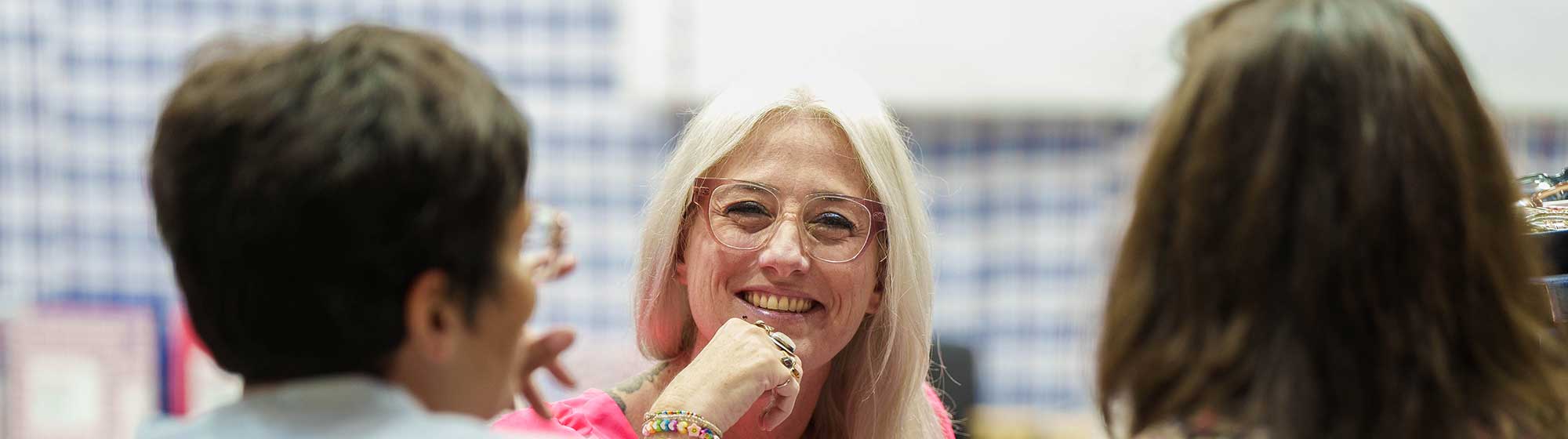 Woman smiling at visitors