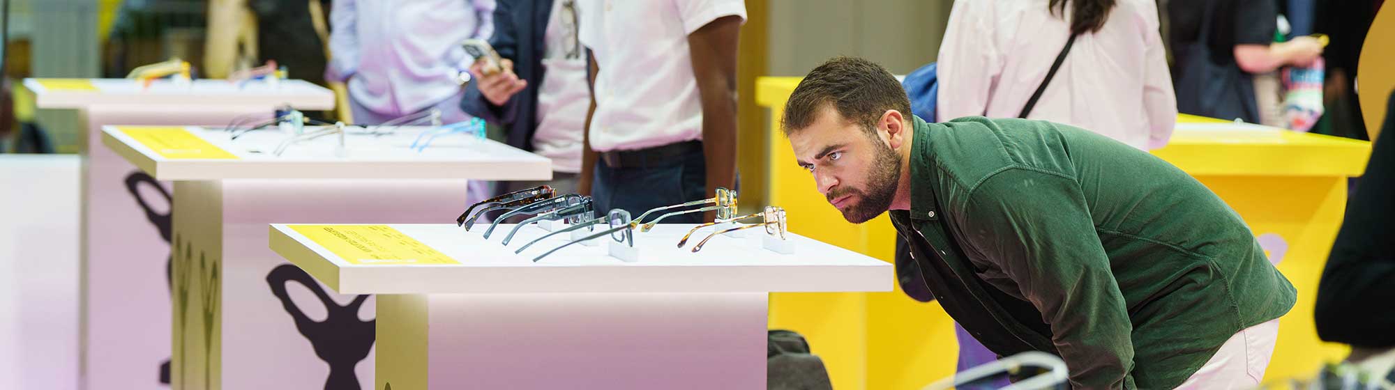 Man observing glasses on a table