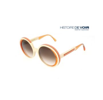 Round sunglasses with orange and cream frames, winner of the Silmo d'Or 2021 Première Classe award