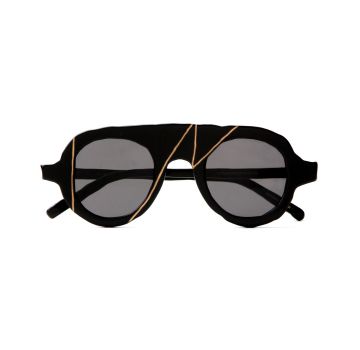 Chic black sunglasses with gold detailing, offering a stylish and luxurious look, winner of the SILMO d'Or 2022 in the category SUNGLASSES « EYEWEAR DESIGNER »