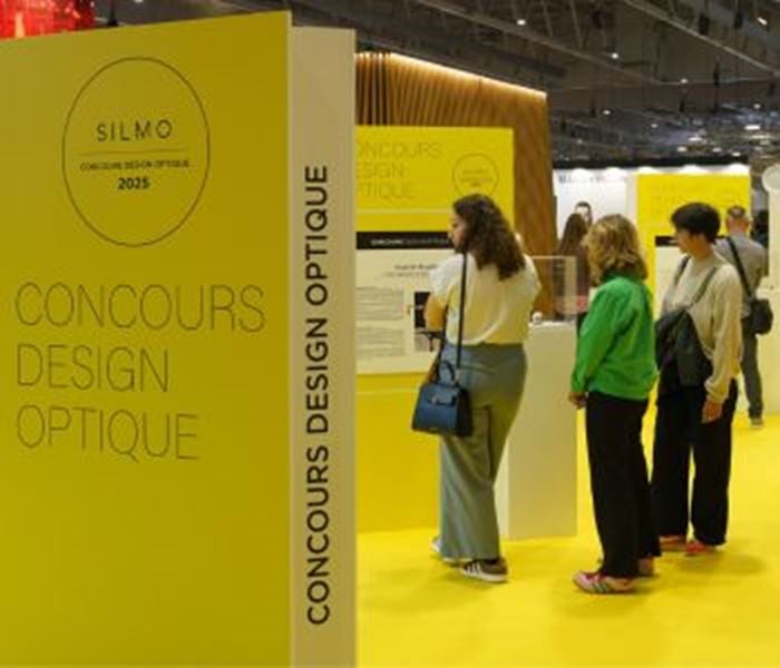 Visitors looking at the finalist projects of the Optical Design Contest