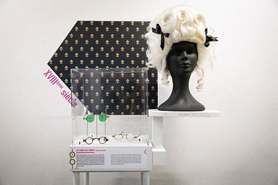 Glasses placed on a bust with a wig