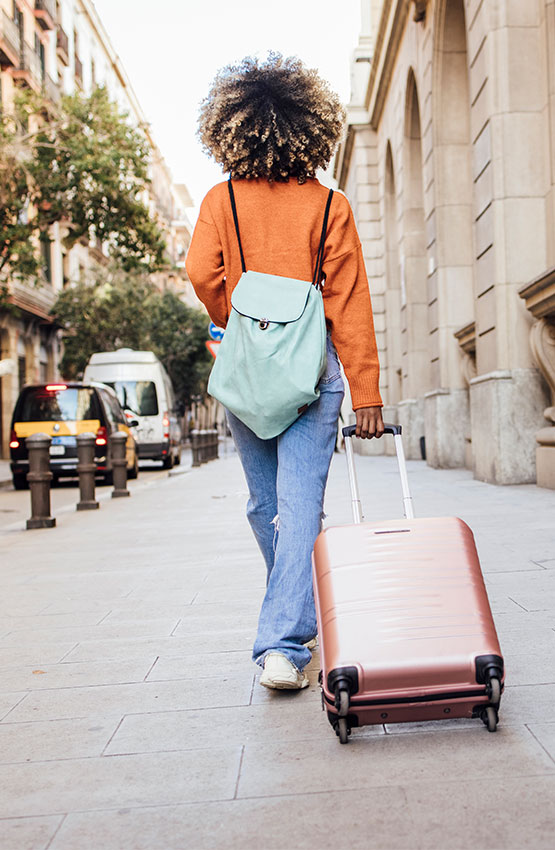 Woman with a suitcase in the street