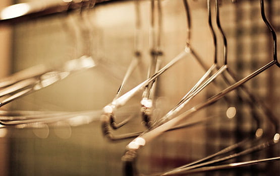 Coat racks hanging in a checkroom