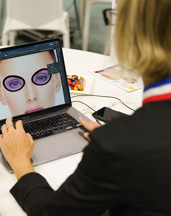 A man and a woman building glasses on a tablet